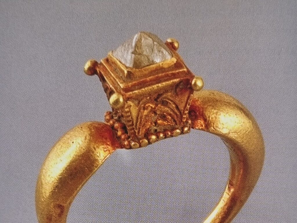 An ancient gold ring set with a point cut diamond